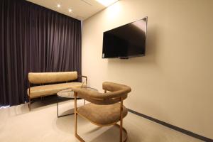 A television and/or entertainment center at Hotel Eco stay