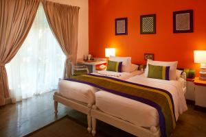 Postelja oz. postelje v sobi nastanitve Hotel Sigiriya