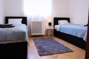 Posteľ alebo postele v izbe v ubytovaní Palace Apartman - Minaret, Eger
