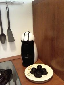 a coffee maker sitting on top of a counter at Staurenghi34apartmenT in Varese