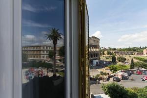 a large building with a view of a city at B&B Colosseo Panoramic Rooms in Rome