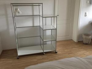 a glass shelf in a room with a bed at Sanderau NA29 in Würzburg +11 photos