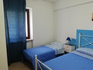 Postel nebo postele na pokoji v ubytování La Sorgente Del Subasio