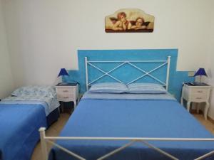 A bed or beds in a room at La Sorgente Del Subasio ASSISI