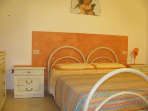 A bed or beds in a room at La Sorgente Del Subasio ASSISI