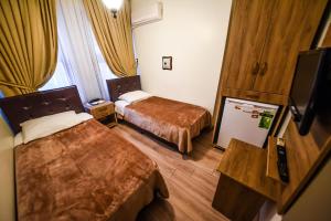 Postel nebo postele na pokoji v ubytování Kosk Hotel Kadikoy