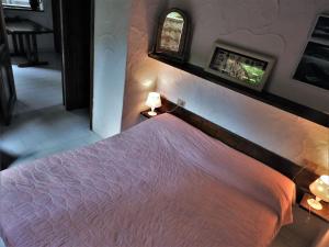 Postel nebo postele na pokoji v ubytování Casa Costa Corallina Mare