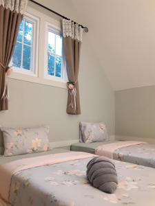 Postel nebo postele na pokoji v ubytování Sky cottage Bungalow