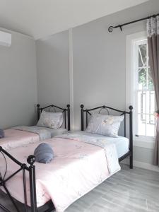 Postel nebo postele na pokoji v ubytování Sky cottage Bungalow