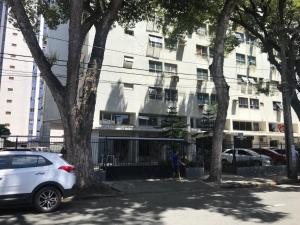 a white car parked in front of a building at Kitnet na Boa Vista, Recife - 508 in Recife