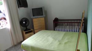 Ένα ή περισσότερα κρεβάτια σε δωμάτιο στο Casa em Furnas-Capitólio