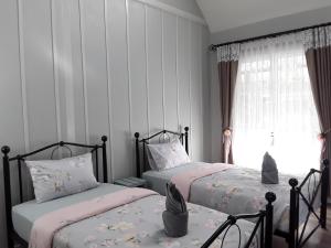 Postel nebo postele na pokoji v ubytování Sky cottage Bungalow