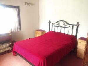 Ένα ή περισσότερα κρεβάτια σε δωμάτιο στο "Mahilo Casa"