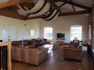 Televiisor ja/või meelelahutuskeskus majutusasutuses The Old Granary Country-retreat