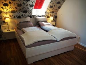 Katil atau katil-katil dalam bilik di Suite in Nieblum - Martina Christiansen