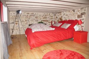 Un pat sau paturi într-o cameră la l'antreTerre et Mer