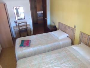 Un ou plusieurs lits dans un hébergement de l'établissement Pereira Guesthouse Cecilia Inn