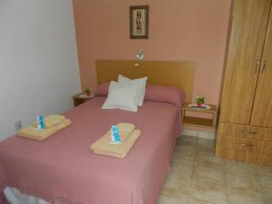 En eller flere senge i et værelse på Hotel El Parque + 56 billeder