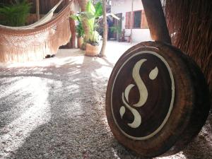 a wooden object with the letter s on it at Serena Tulum - Adults Only in Tulum