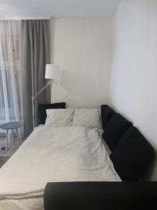 Postel nebo postele na pokoji v ubytování Apartmány Stříbro