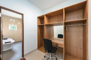 a home office with a desk and a chair at Liam Private Villa in Ubud +15 photos