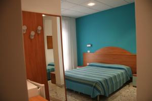 Postel nebo postele na pokoji v ubytování B&B Vittoria