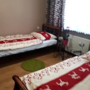
Łóżko lub łóżka w pokoju w obiekcie Agroturystyka "JAGAP" OAZA SPOKOJU
