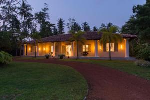 a house with lights on the side of it at Monara House, Talpe in Unawatuna