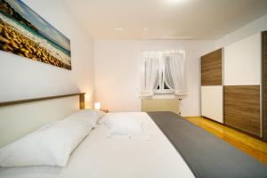 Ένα ή περισσότερα κρεβάτια σε δωμάτιο στο Apartment Anton