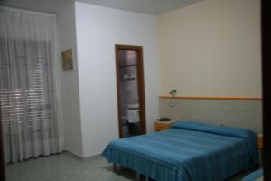 Postel nebo postele na pokoji v ubytování B&B Vittoria