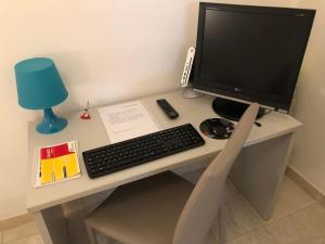 Telewizja i/lub zestaw kina domowego w obiekcie Casa Comasia