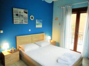 Ένα ή περισσότερα κρεβάτια σε δωμάτιο στο Lioharis Villa