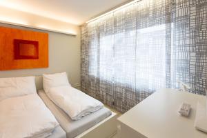 Ein Bett oder Betten in einem Zimmer der Unterkunft Wohnung für 4 Pers in Sechtem bei Köln/Bonn, DB-Anschluß