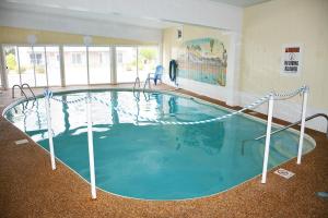 a large swimming pool in a large room at Alouette Beach Resort Economy Rooms in Old Orchard Beach