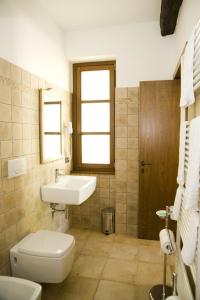 a bathroom with a sink and a toilet at Agriturismo Aqua Viva in Acquaviva Picena +27 photos