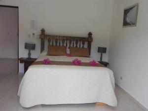 Postel nebo postele na pokoji v ubytování Hotel Rancho Don Cesar