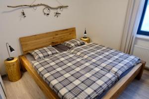 Posteľ alebo postele v izbe v ubytovaní Apartmány BD Boží Dar