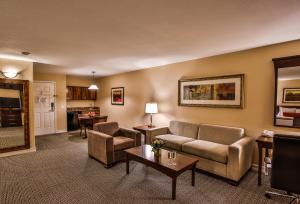 a living room with a couch and a table at Tuscany Suites & Casino in Las Vegas