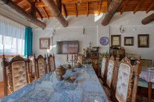 a dining room with a long table and chairs at Kirazlı Sultan Konak in Kirazli