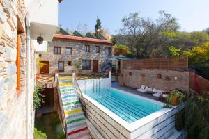 an external view of a house with a swimming pool at Kirazlı Sultan Konak in Kirazli