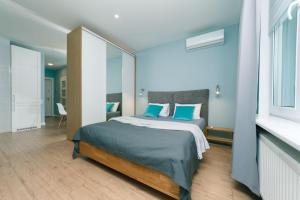 Posteľ alebo postele v izbe v ubytovaní Happy apartment, warmth, comfort, turquoise