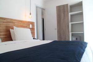Cama ou camas em um quarto em Hotel Florinda