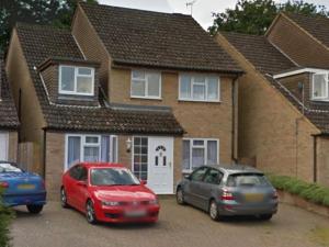 three cars parked in front of a house at The Marlborough in Crawley