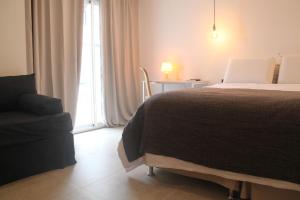 Cama ou camas em um quarto em Hotel Florinda