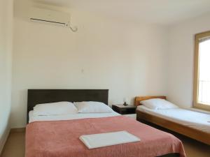 a room with two beds and a window at VILLA DARIA in Pakoštane +115 photos