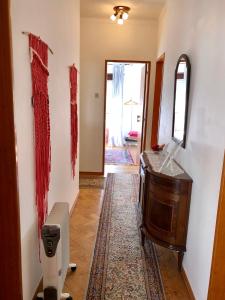 a hallway with a room with a dresser and a mirror at Lines of Wellignton in Torres Vedras +40 photos