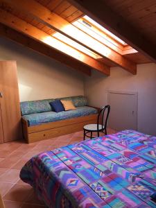 A bed or beds in a room at Mansarda Margherita
