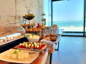a buffet line with many different types of food at RQ Antofagasta in Antofagasta