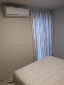 Postel nebo postele na pokoji v ubytování Apt Interiro Praia de Itapema