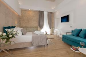 A bed or beds in a room at Navona Style